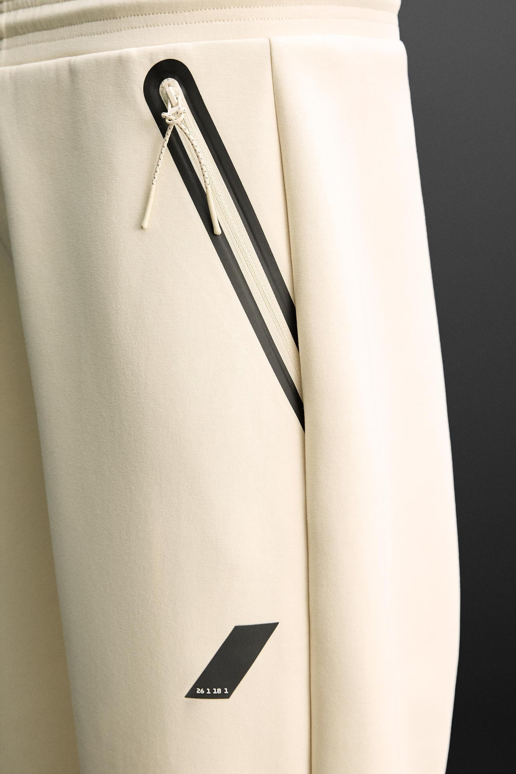 TECHNICAL ZIPPER JOGGER PANTS Product Image