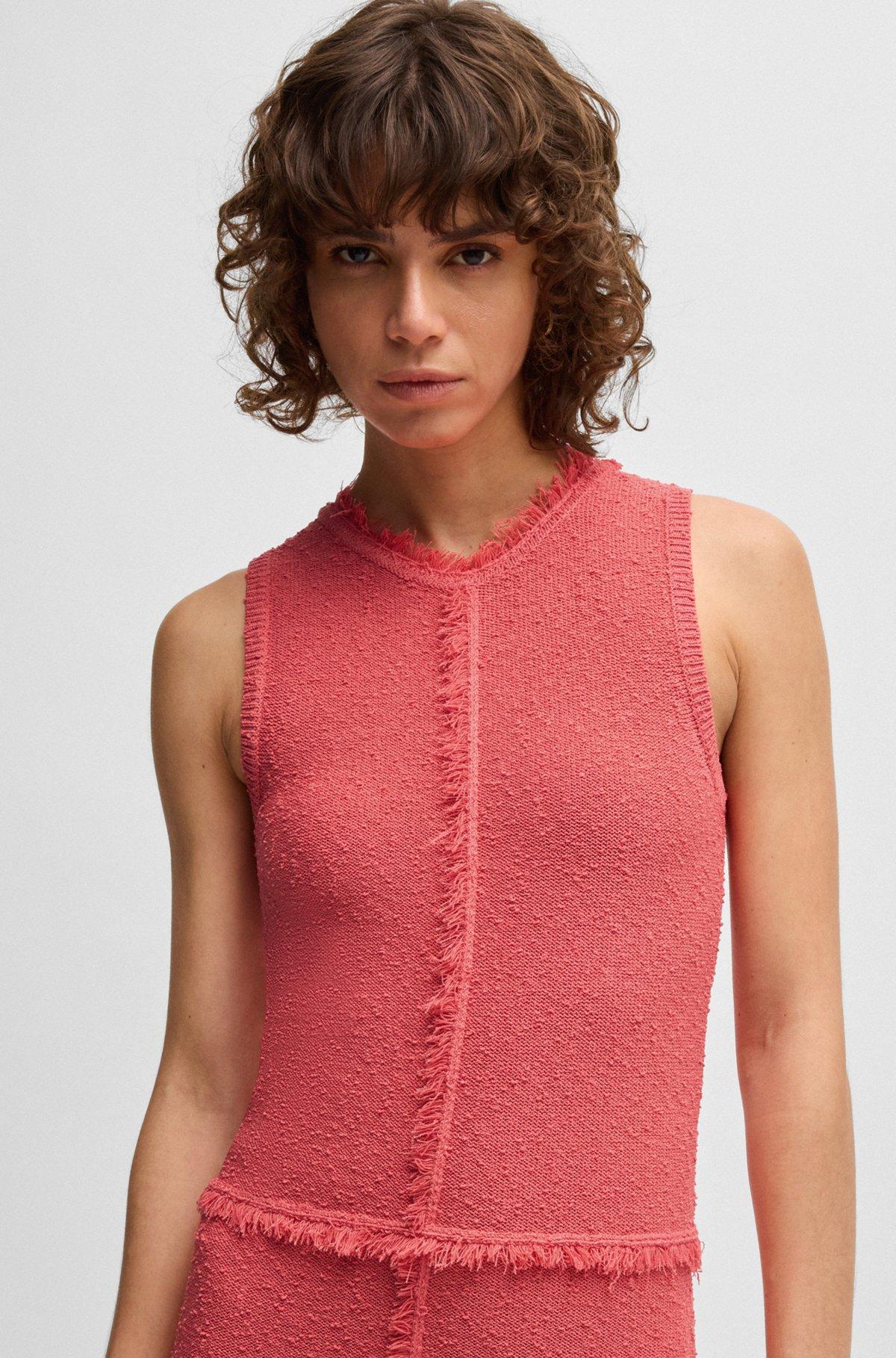 Sleeveless knitted dress with fringe trims Product Image