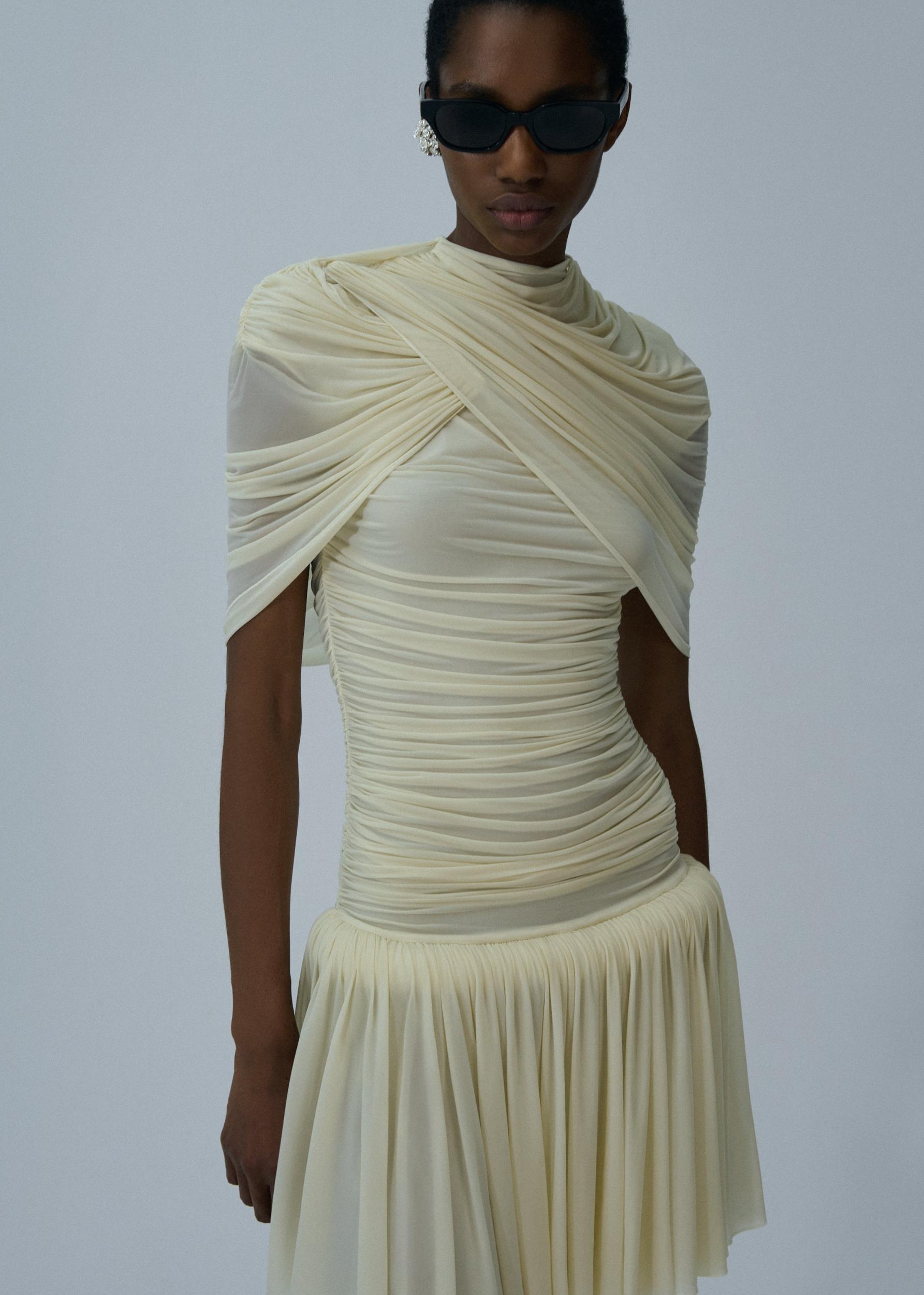 Drop-waist wrap mini dress in beige Product Image