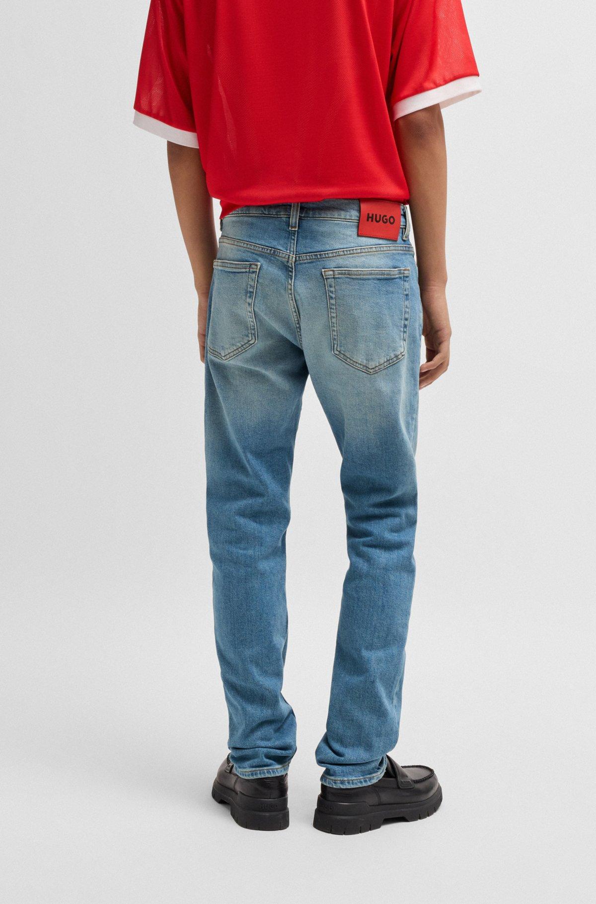 Slim-fit jeans in mid-blue stretch denim Product Image