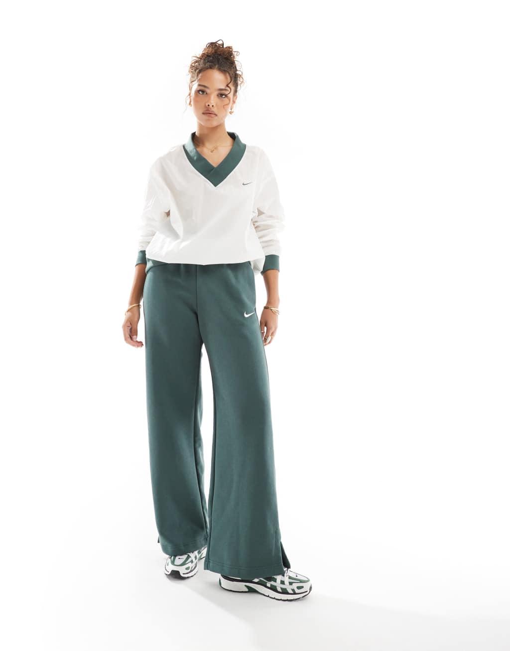 Nike Essential woven v-neck sweatshirt in off white and green Product Image