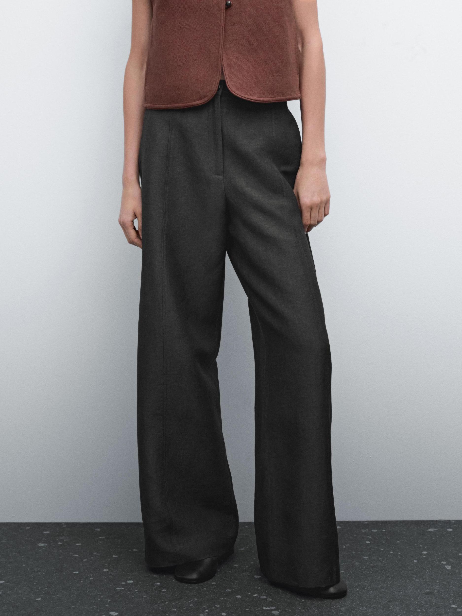 Flowing wide-leg trousers with seam details Product Image