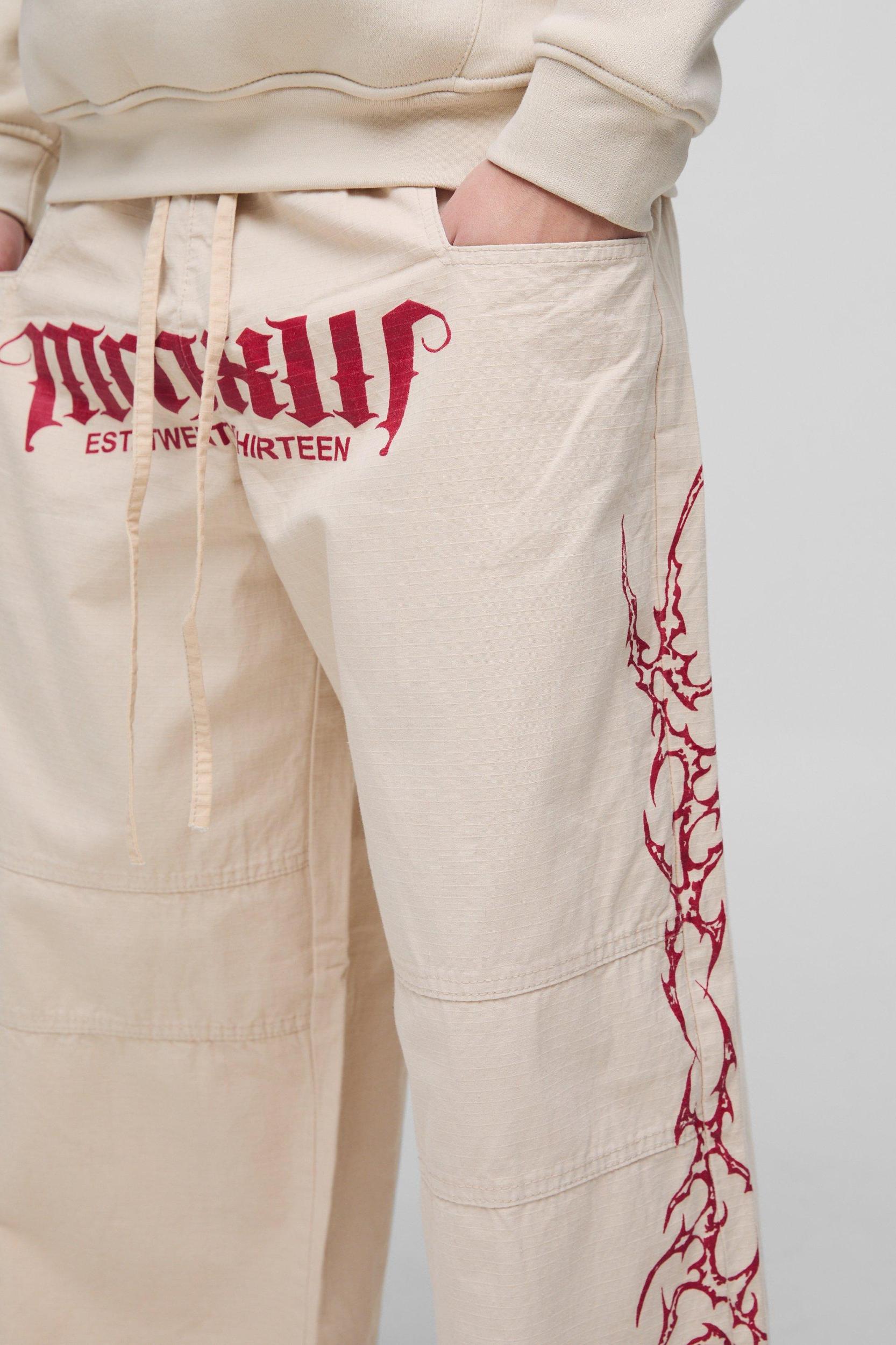 Elasticated Waist Parachute Acid Wash Ripstop Printed Pants | boohooMAN USA Product Image