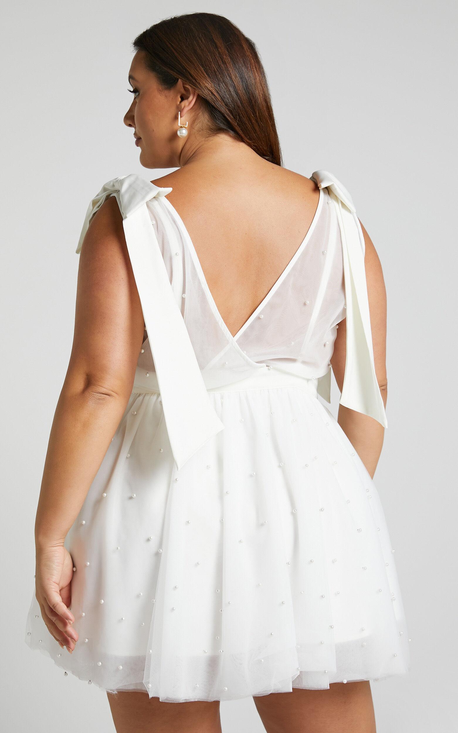 Karalyn Mini Dress - Bow Strap Plunge Pearl Detail Dress in White Product Image