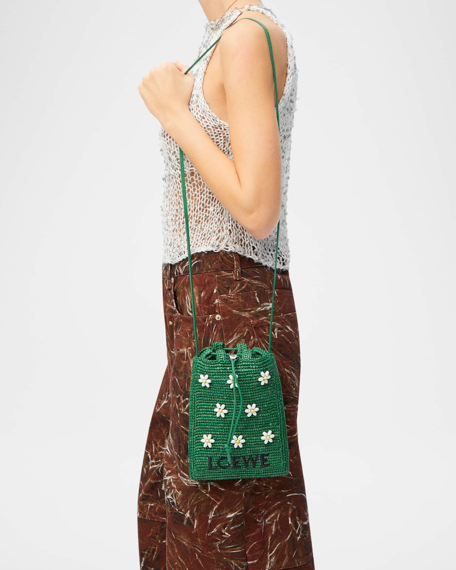 x Paula’s Ibiza Drawstring Pocket Flower Crossbody Bag in Raffia Product Image