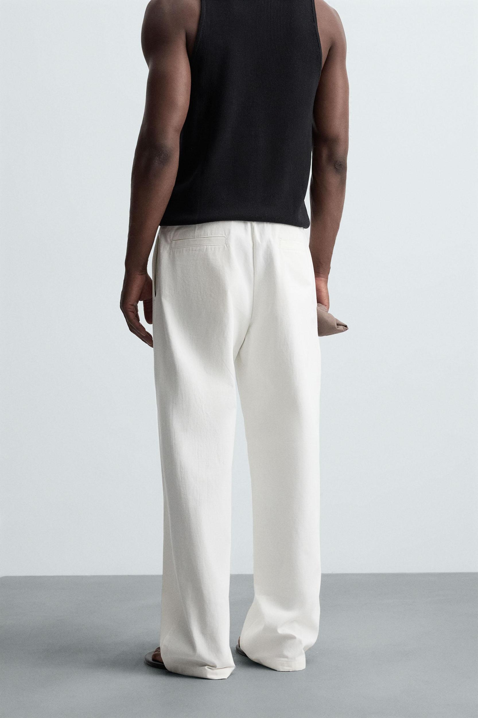 RELAXED FIT PLEATED PANTS Product Image