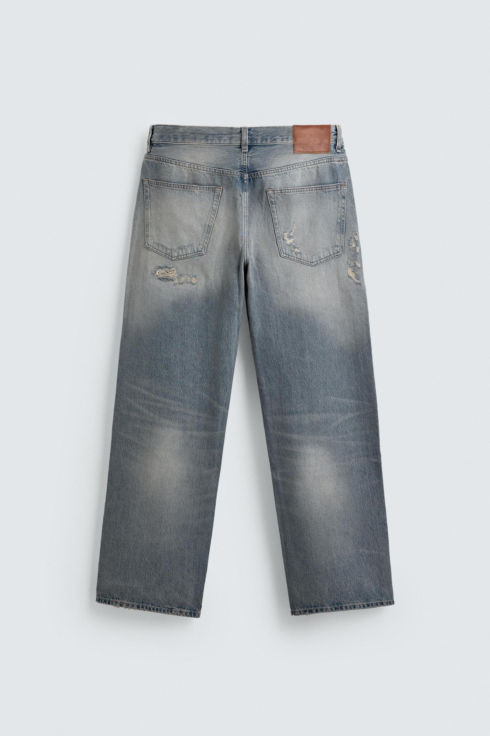 LOOSE FIT RIPPED JEANS Product Image