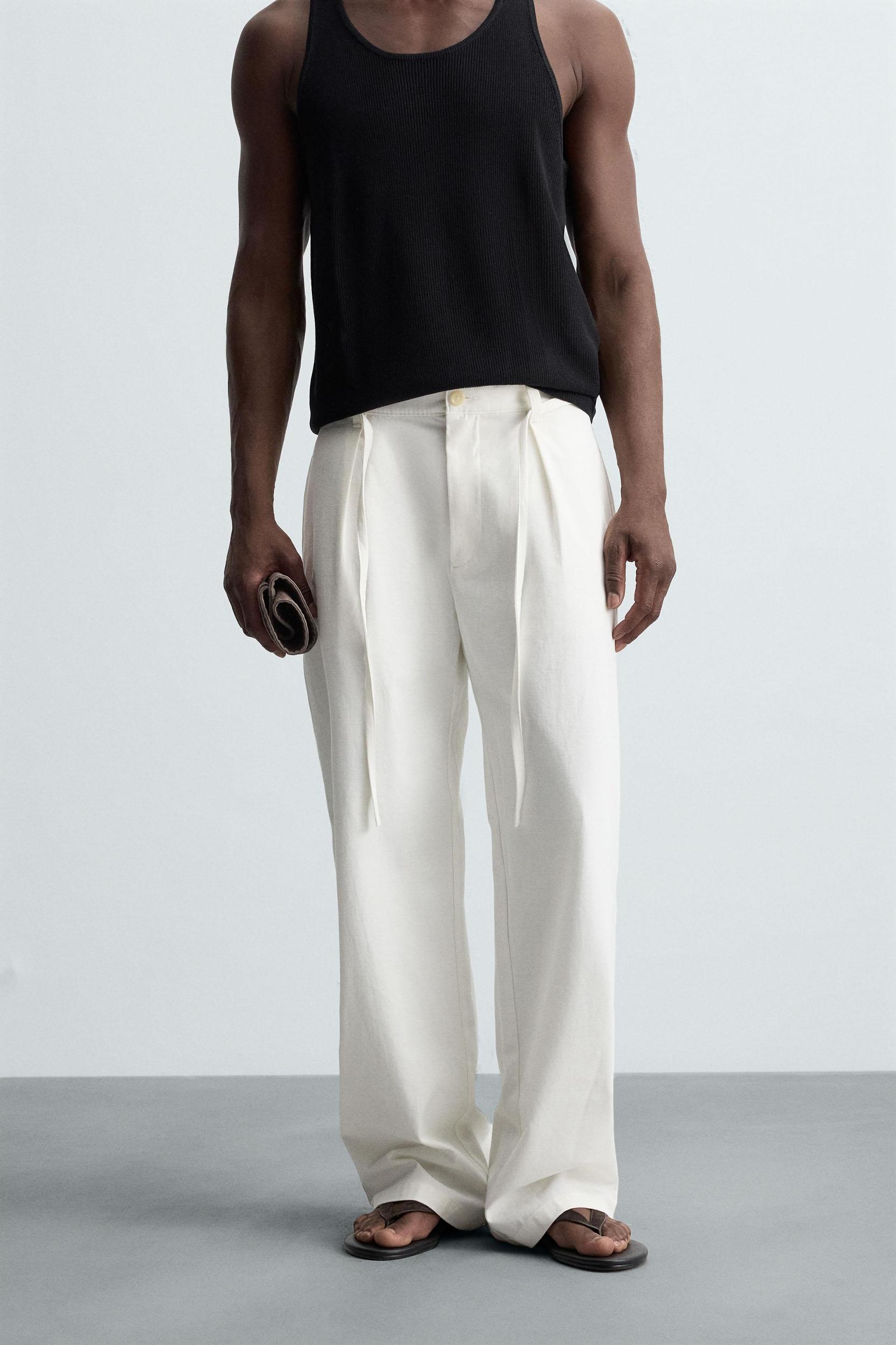 RELAXED FIT PLEATED PANTS Product Image