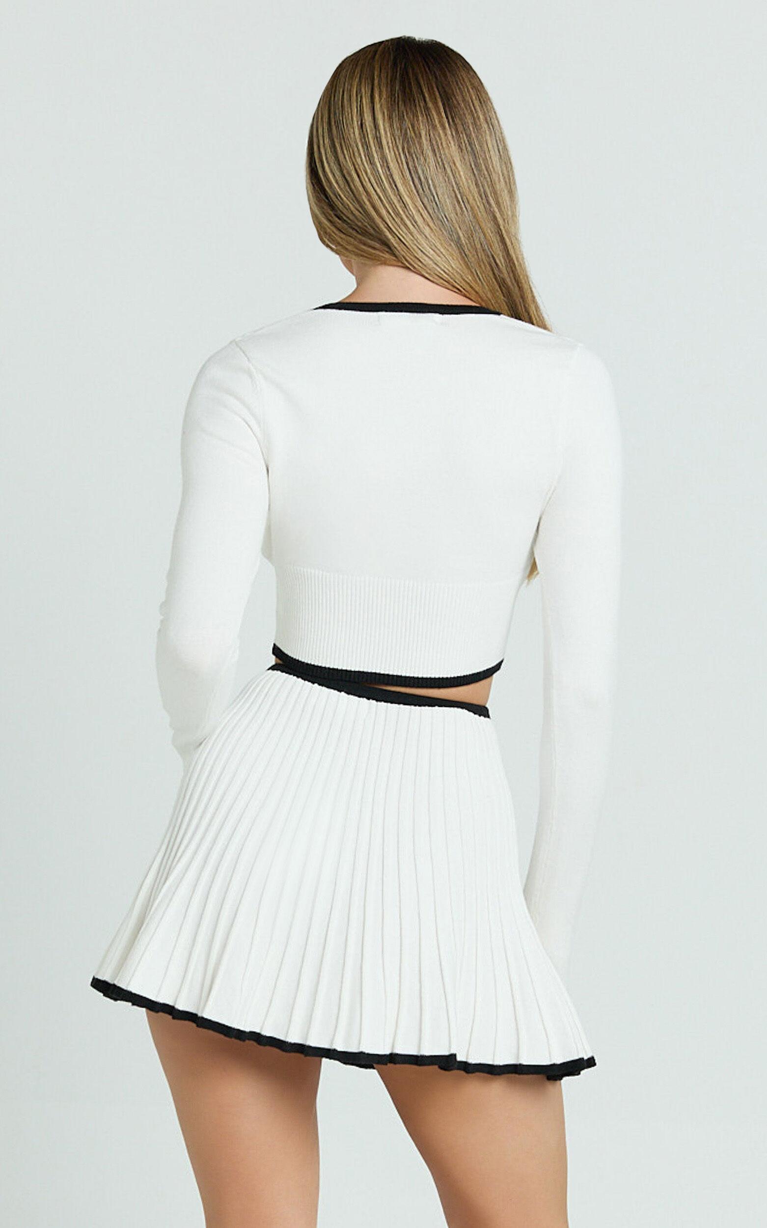 Naomi Two Piece Set - Contrast Knit Button Up Long Sleeve And Pleated Mini Skirt in Cream Product Image