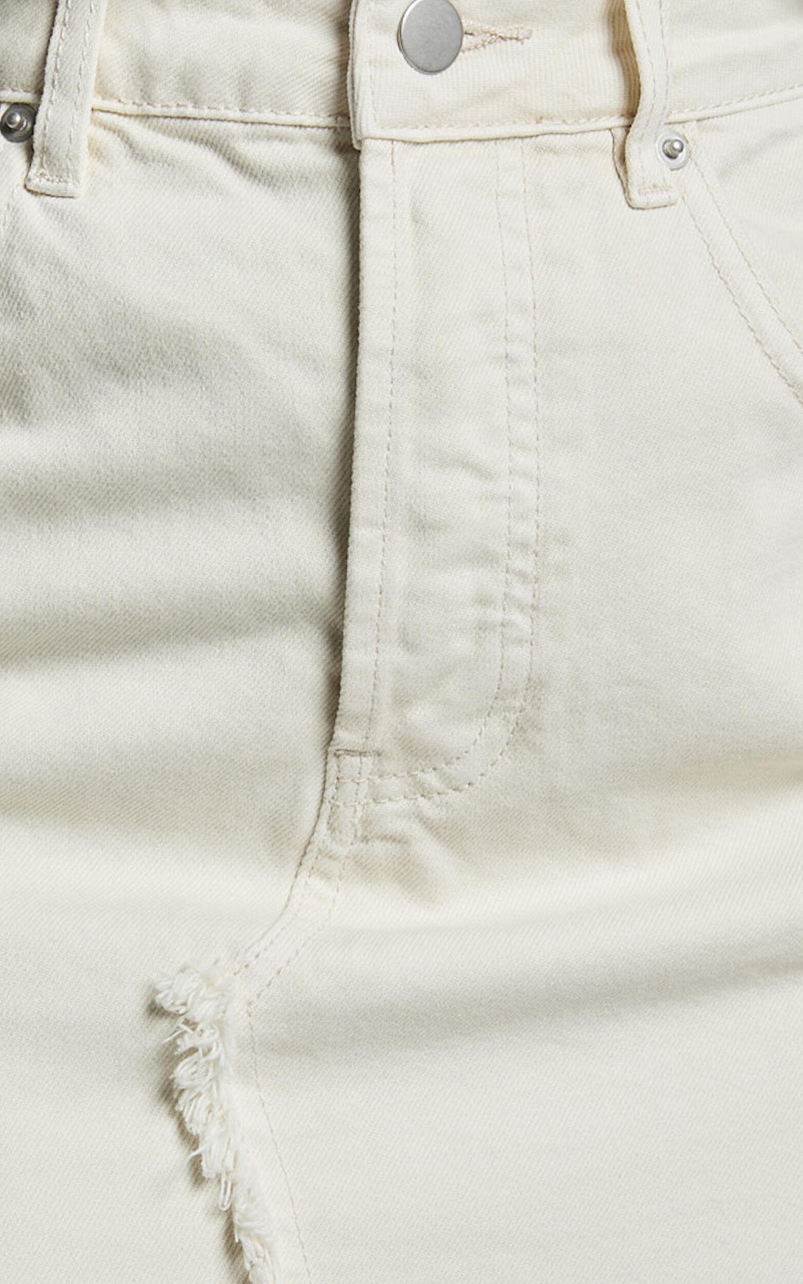 Pieta Mini Skirt - Recycled Cotton Raw Hem Denim Skirt in Ecru Product Image