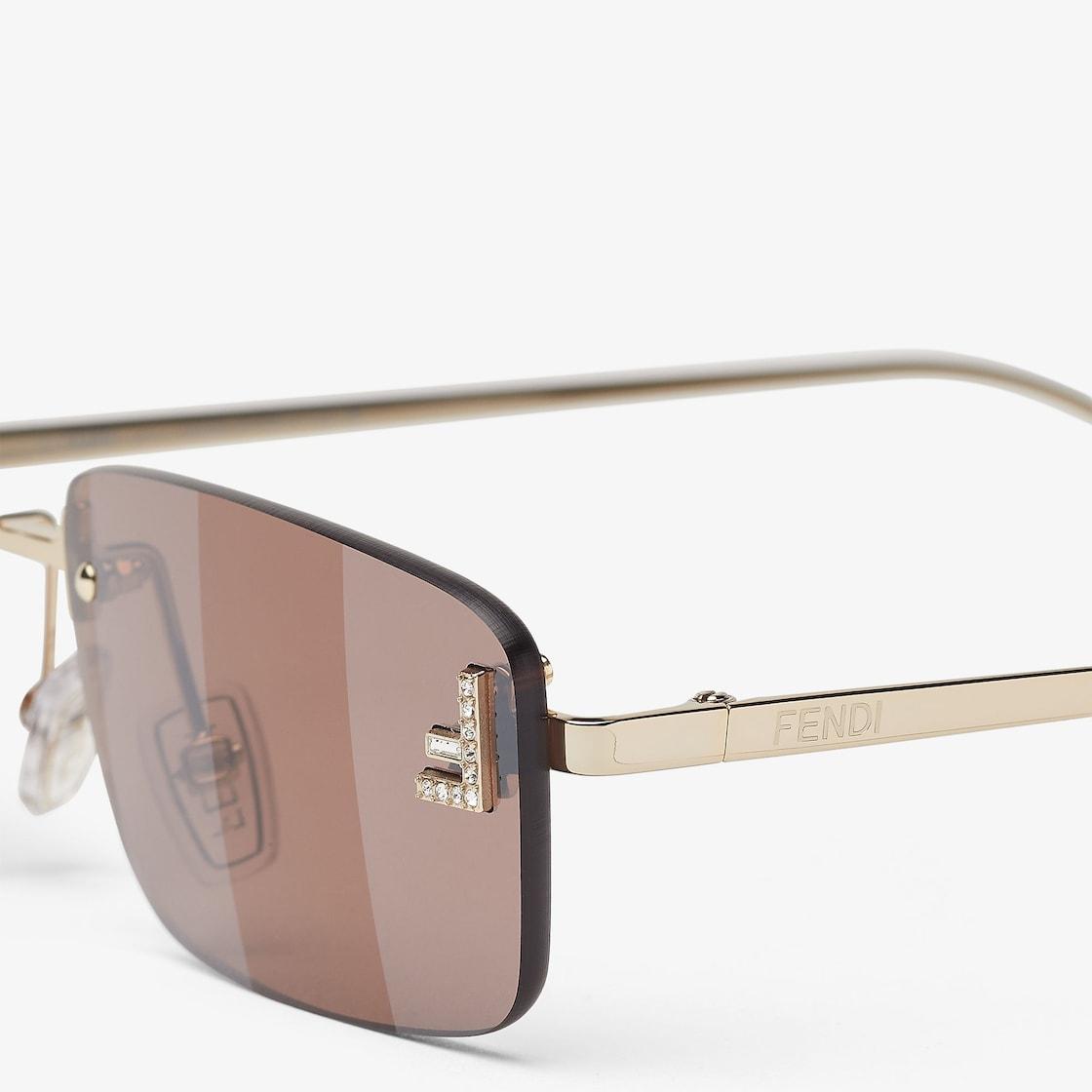 Fendi First CrystalGold-colored sunglasses with rust-colored lenses Product Image