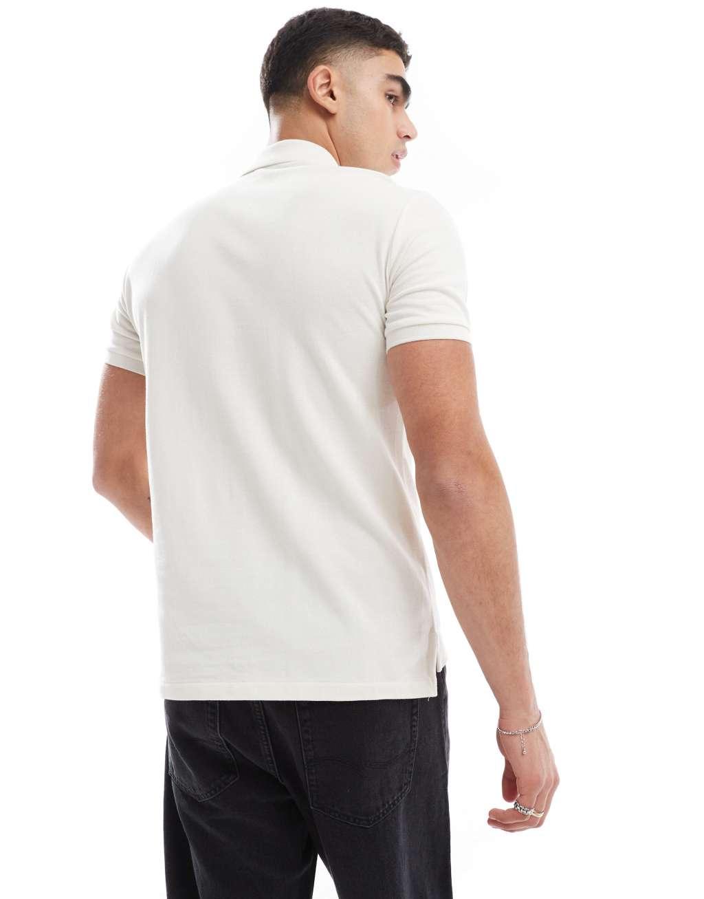 Polo Ralph Lauren icon logo slim fit pique polo in cream Product Image