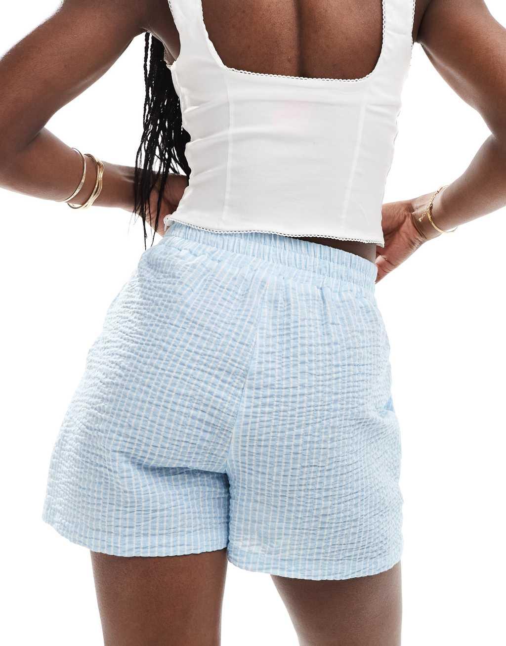 ASOS DESIGN seersucker tie waist shorts in blue & white stripe Product Image