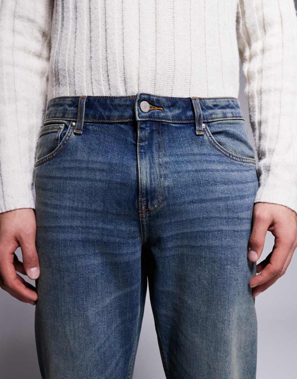 ASOS DESIGN stretch tapered jeans in mid wash with tint Product Image